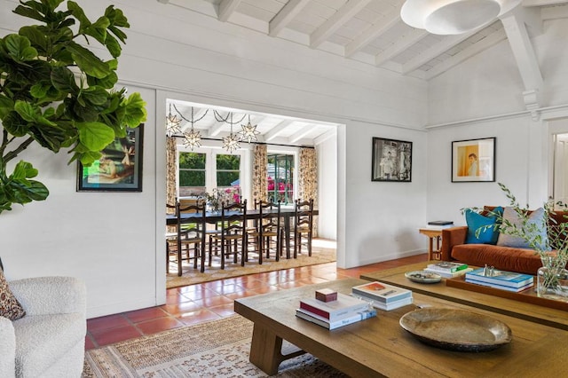 living room with lofted ceiling with beams, tile patterned floors, and a notable chandelier