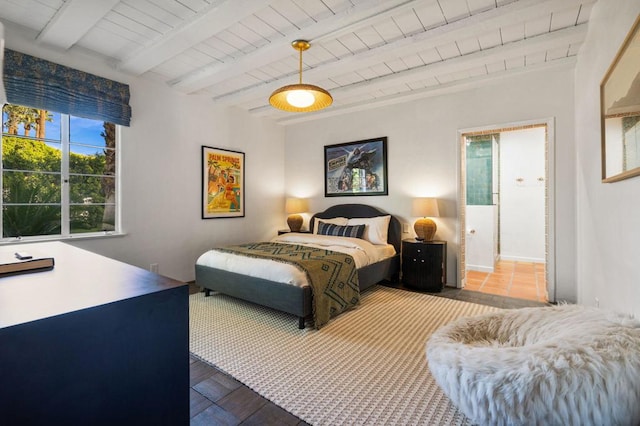 bedroom with beam ceiling, wood-type flooring, and wooden ceiling