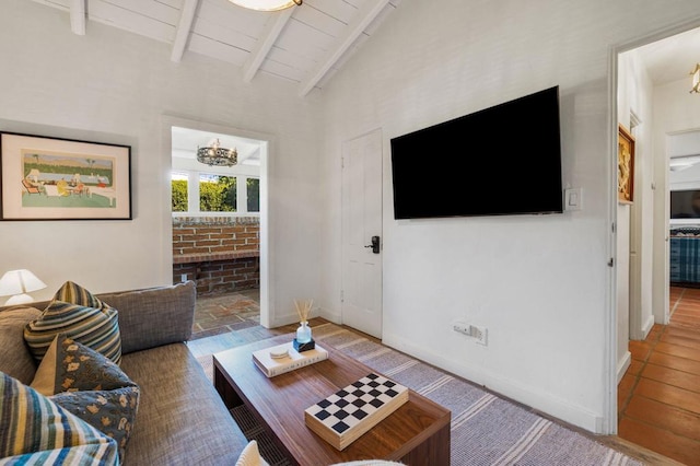 living room with wood-type flooring and vaulted ceiling with beams