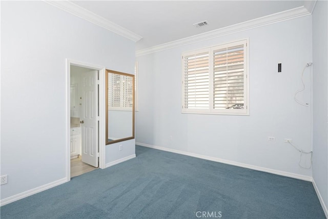 carpeted empty room featuring ornamental molding