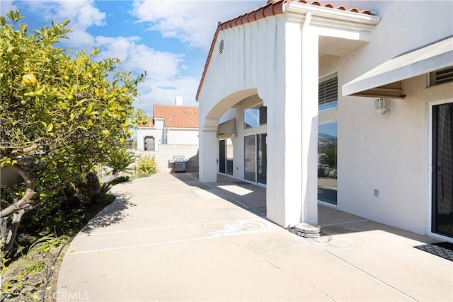 exterior space featuring a patio and cooling unit