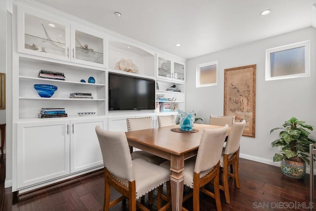 dining space with dark hardwood / wood-style flooring