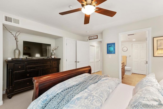 bedroom with ensuite bathroom, ceiling fan, and a closet