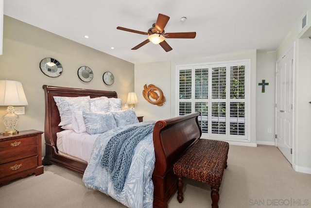 bedroom featuring ceiling fan and light carpet