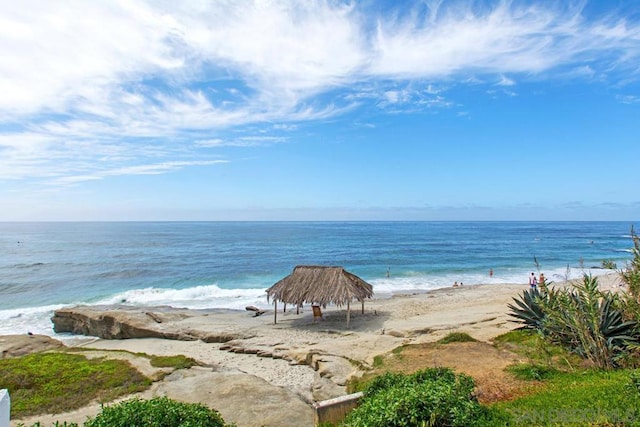 property view of water with a gazebo and a beach view