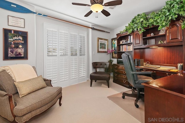 office space featuring light colored carpet and ceiling fan