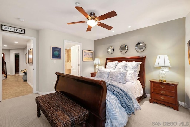 carpeted bedroom featuring connected bathroom and ceiling fan