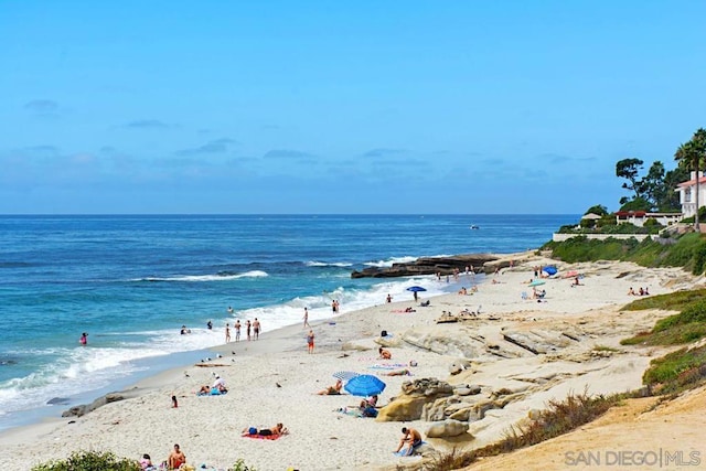 property view of water featuring a beach view