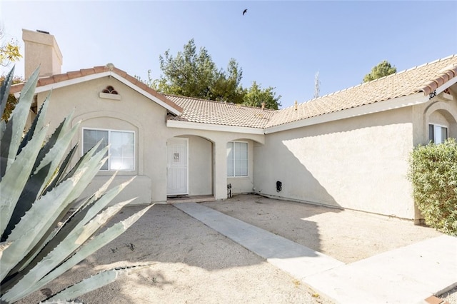 property entrance featuring a patio