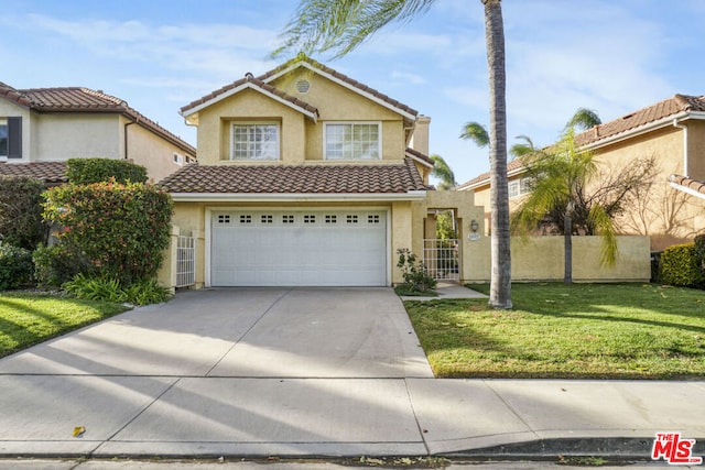 view of front property with a garage and a front lawn