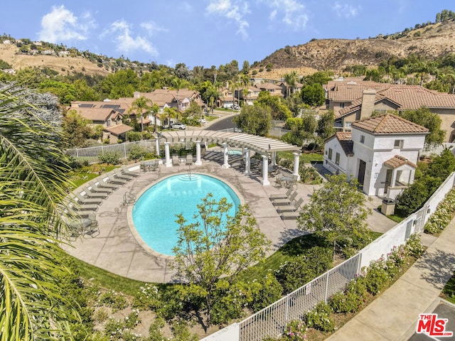 view of swimming pool with a pergola