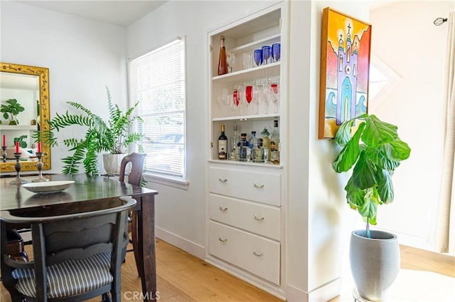 interior space featuring white cabinets and light hardwood / wood-style flooring