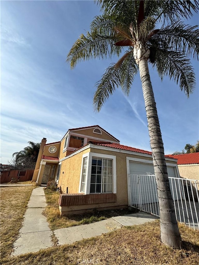 view of side of property featuring a garage