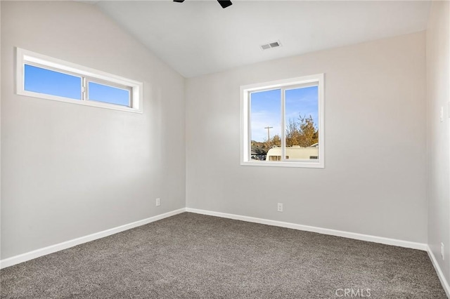 unfurnished room featuring vaulted ceiling, ceiling fan, and carpet flooring