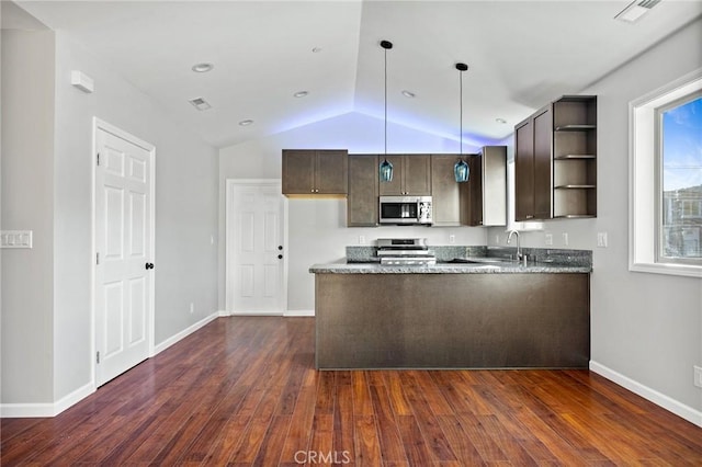 kitchen featuring stone counters, appliances with stainless steel finishes, dark brown cabinetry, decorative light fixtures, and kitchen peninsula