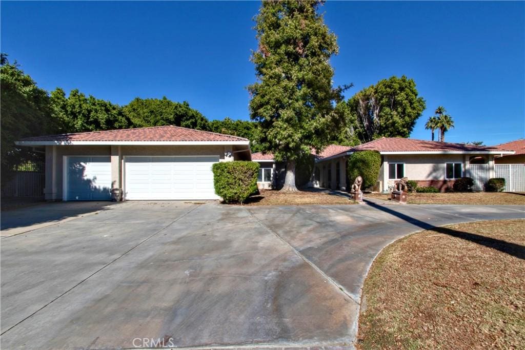 single story home with a garage