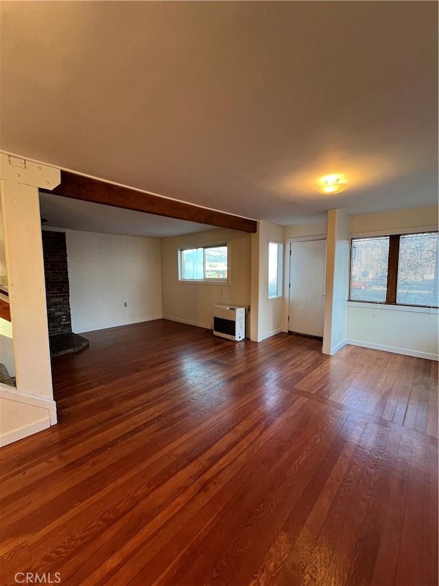 unfurnished living room with dark wood-type flooring