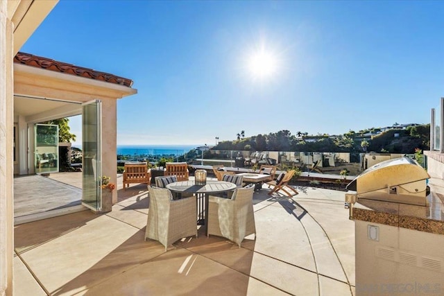 view of patio / terrace featuring a water view