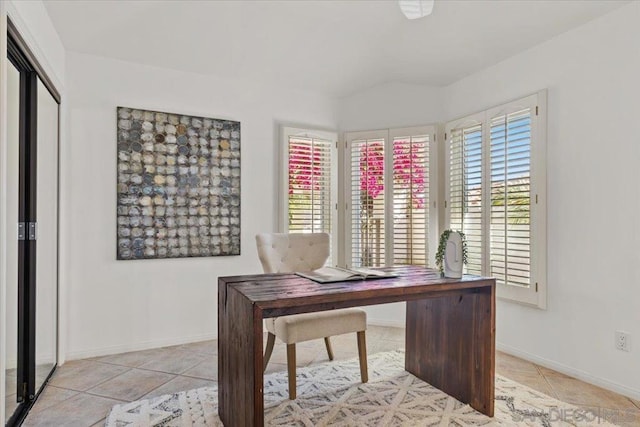 tiled office featuring a wealth of natural light