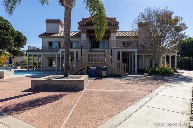 rear view of property featuring a patio area