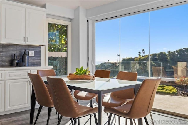 dining space featuring wood-type flooring