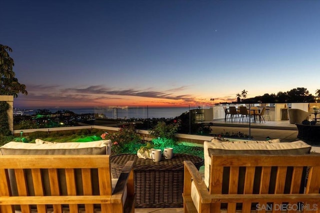 balcony at dusk with a water view