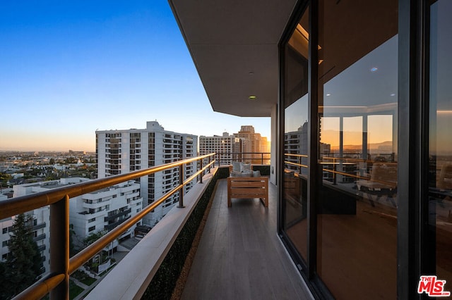 view of balcony at dusk