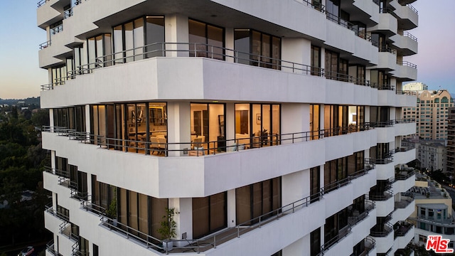 view of outdoor building at dusk