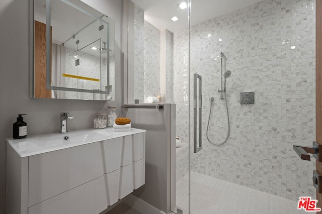 bathroom with vanity and walk in shower