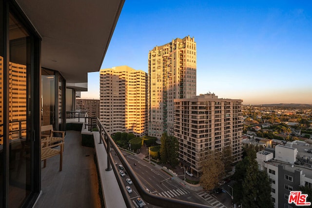 view of balcony at dusk