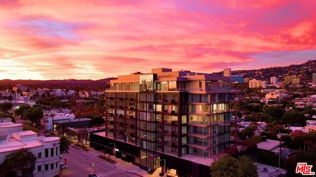 view of outdoor building at dusk