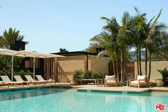 view of swimming pool featuring a patio