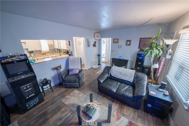 living room with dark hardwood / wood-style floors