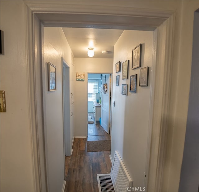 hall with dark hardwood / wood-style flooring