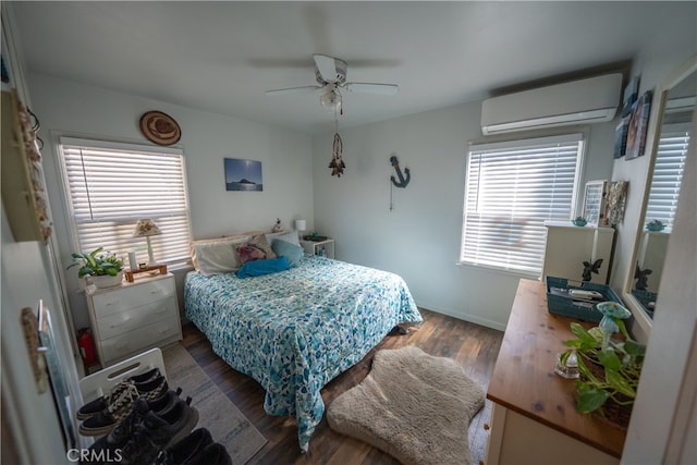 bedroom featuring a wall mounted air conditioner, hardwood / wood-style flooring, and ceiling fan