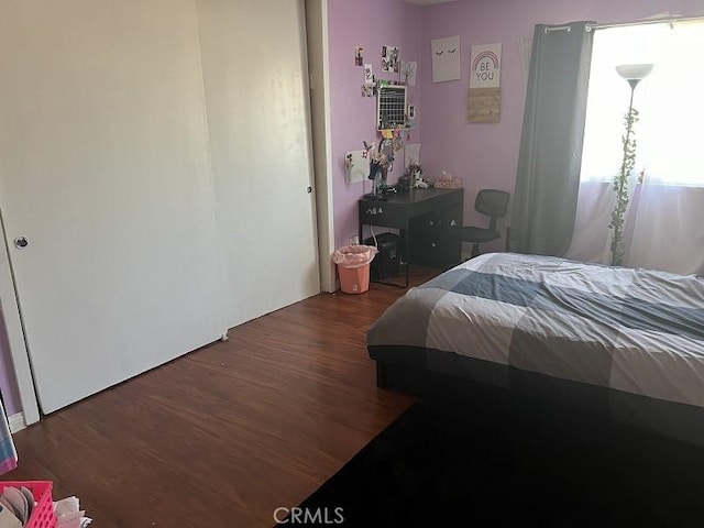 bedroom featuring dark hardwood / wood-style floors