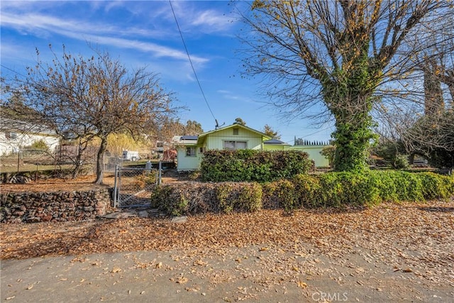 view of side of property with solar panels