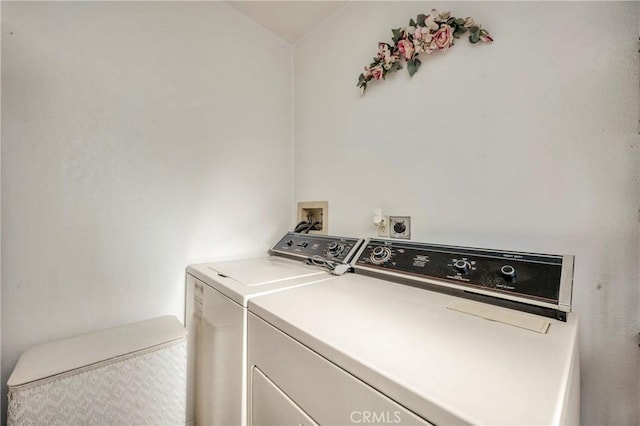 laundry area with independent washer and dryer