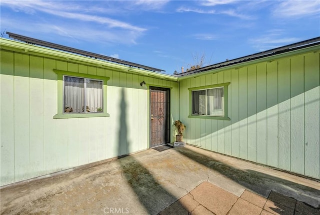 doorway to property with a patio area