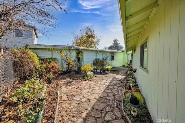 view of side of property with a patio