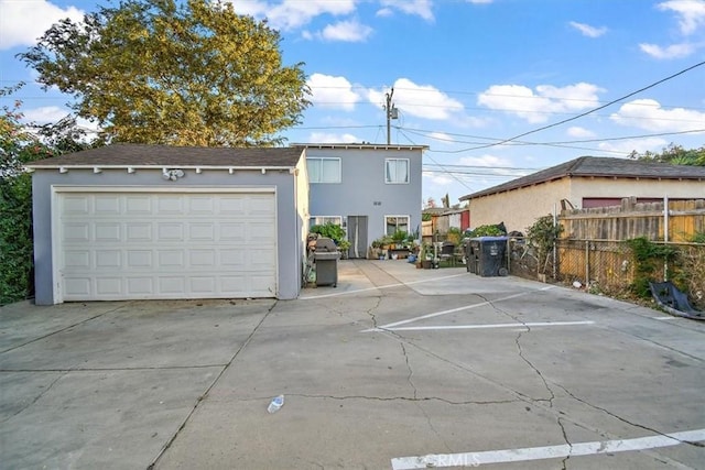 view of front of house featuring an outdoor structure and a garage