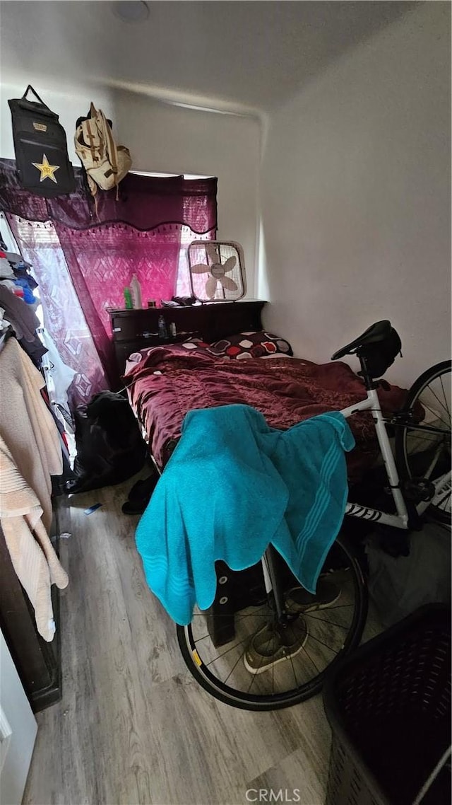 bedroom with wood-type flooring