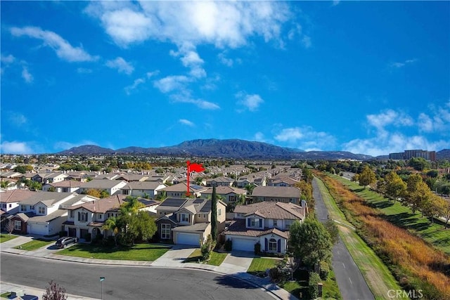 birds eye view of property with a mountain view