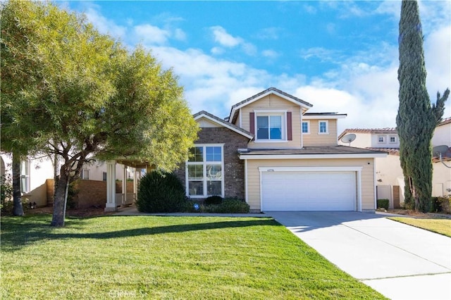 view of front of house with a garage and a front yard