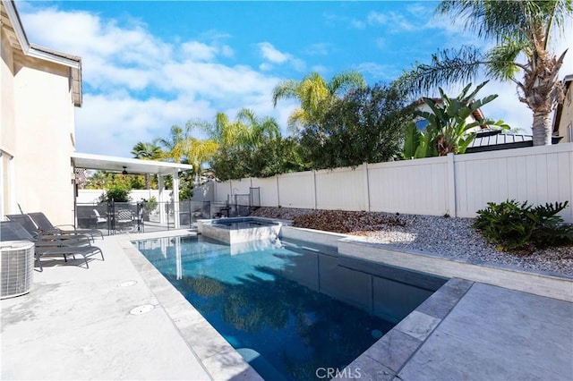 view of pool with ceiling fan, cooling unit, a patio area, and an in ground hot tub