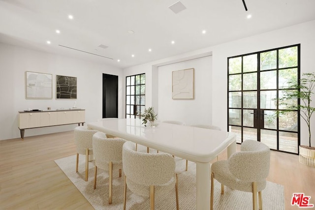 dining space featuring light hardwood / wood-style flooring