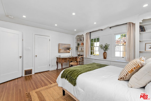 bedroom with light hardwood / wood-style flooring