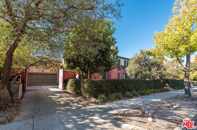 obstructed view of property featuring a garage