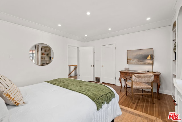 bedroom with wood-type flooring