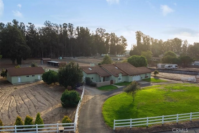 birds eye view of property with a rural view